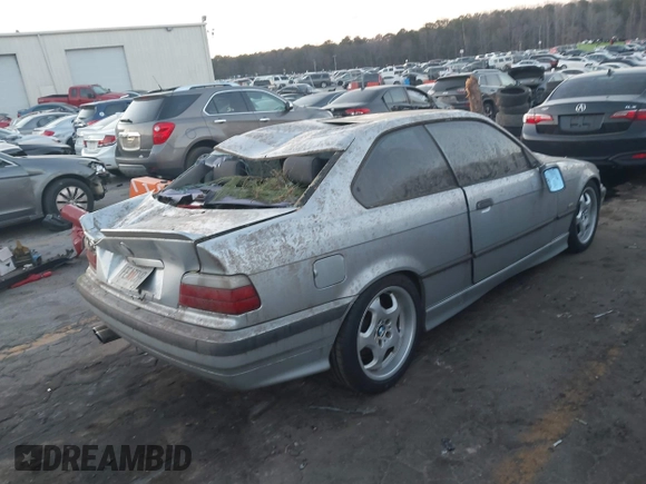 1998 BMW 3 Series 328is with VIN WBABG1329WET06968, listed as a IAAI auction lot 41656215 with 270,000 mi miles. Bid and sale history available at carsss.com. Image 4.