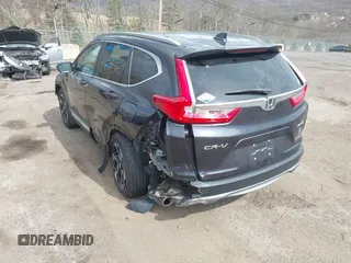 2019 Honda CR-V Touring with VIN 2HKRW2H9XKH636354, listed as a IAAI auction lot 41902615 with 66,781 mi miles and . Bid and sale history available at DreamBid. Image 3.