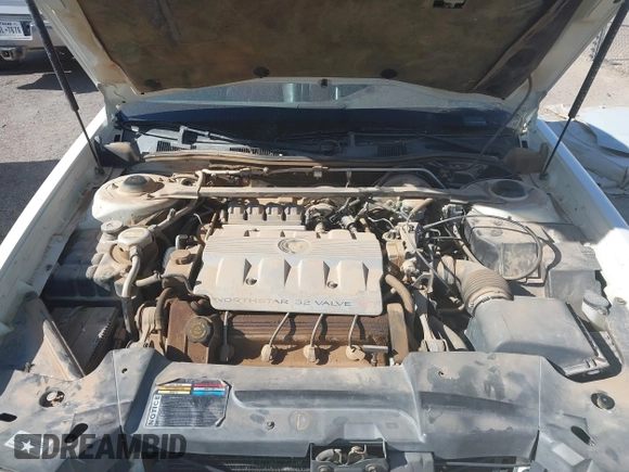 1999 Cadillac DeVille z VIN 1G6KD54Y6XU728681, wystawiony jako IAAI lot #41362191 z przebiegiem 163 540 mil mil oraz . Historia ofert i sprzedaży dostępna na DreamBid. Obrazek 10.