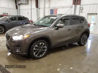 2016 Mazda CX-5 Grand Touring z VIN JM3KE4DY6G0853263, wystawiony jako Copart lot #55131415 z przebiegiem 111 087 mil mil oraz Czysty tytuł • Clean title. Historia ofert i sprzedaży dostępna na DreamBid. Obrazek 1.