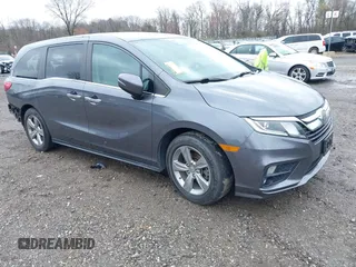 2018 Honda Odyssey EX-L z VIN 5FNRL6H70JB025227, wystawiony jako IAAI lot #41940992 z przebiegiem 95 797 mil mil oraz . Historia ofert i sprzedaży dostępna na DreamBid. Obrazek 1.