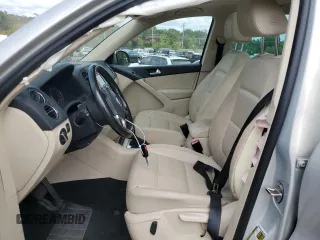 2013 Volkswagen Tiguan SE z VIN WVGBV7AX0DW539618, wystawiony jako Copart lot #71529804 z przebiegiem 148 362 mil mil oraz Szkoda całkowita • Salvage title. Historia ofert i sprzedaży dostępna na DreamBid. Obrazek 7.