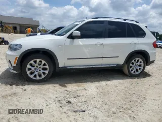 2012 BMW X5 35i z VIN 5UXZV4C58CL987049, wystawiony jako Copart lot #61013925 z przebiegiem 167 508 mil mil oraz Czysty tytuł • Clean title. Historia ofert i sprzedaży dostępna na DreamBid. Obrazek 1.
