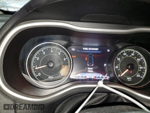 2014 Jeep Cherokee Trailhawk with VIN 1C4PJMBSXEW187981, listed as a Copart auction lot 56711885 with 157,317 mi miles and Salvage title. Bid and sale history available at DreamBid. Image 9.