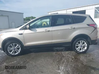2017 Ford Escape SE with VIN 1FMCU9GD1HUC70823, listed as a IAAI auction lot 41898457 with 86,042 mi miles and . Bid and sale history available at DreamBid. Image 14.