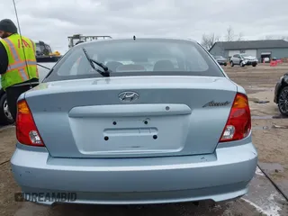 2003 Hyundai Accent GL with VIN KMHCG35C23U264360, listed as a IAAI auction lot 42033316 with 100,991 mi miles. Bid and sale history available at carsss.com. Image 16.