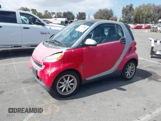 2009 Smart fortwo Pure z VIN WMEEJ31X59K245895, wystawiony jako IAAI lot #42266793 z przebiegiem 120 497 mil mil oraz . Historia ofert i sprzedaży dostępna na DreamBid. Obrazek 2.