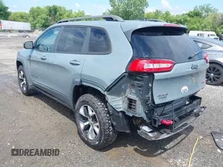 2014 Jeep Cherokee Trailhawk z VIN 1C4PJMBS4EW236950, wystawiony jako IAAI lot #42636128 z przebiegiem 170 491 mil mil oraz . Historia ofert i sprzedaży dostępna na DreamBid. Obrazek 3.