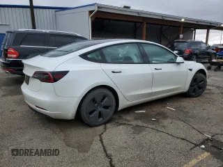 2023 Tesla Model 3 with VIN 5YJ3E1EAXPF600008, listed as a Copart auction lot 51868055 with 58,733 mi miles and Salvage title. Bid and sale history available at DreamBid. Image 3.