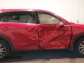 2017 Mazda CX-9 Touring z VIN JM3TCBCY2H0131659, wystawiony jako IAAI lot #41674239 z przebiegiem 168 129 mil mil oraz . Historia ofert i sprzedaży dostępna na DreamBid. Obrazek 13.