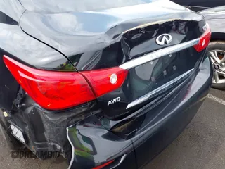 2015 Infiniti Q50 z VIN JN1BV7AR6FM412573, wystawiony jako IAAI lot #41796802 z przebiegiem 136 410 mil mil oraz . Historia ofert i sprzedaży dostępna na DreamBid. Obrazek 18.