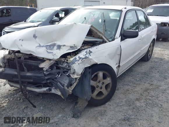 2000 Mazda Protege DX with VIN JM1BJ2221Y0208156, listed as a IAAI auction lot 41609657 with 435,304 mi miles and . Bid and sale history available at DreamBid. Image 6.
