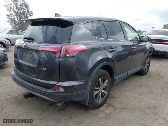 2018 Toyota RAV4 XLE with VIN JTMWFREV4JJ742463, listed as a IAAI auction lot 41920716 with 61,141 mi miles. Bid and sale history available at carsss.com. Image 4.