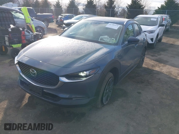 2023 Mazda CX-30 S Carbon Edition with VIN 3MVDMBCM1PM573317, listed as a IAAI auction lot 41785371 with 6,475 mi miles and . Bid and sale history available at DreamBid. Image 2.