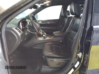 2015 Jeep Grand Cherokee Overland with VIN 1C4RJFCG8FC653117, listed as a Copart auction lot 49254595 with 142,359 mi miles and Clean Title. Bid and sale history available at carsss.com. Image 7.