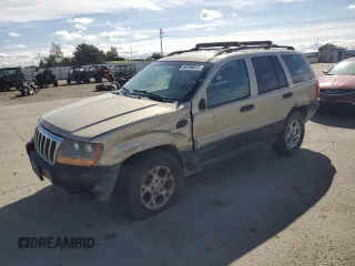 2000 Jeep Grand Cherokee Laredo z VIN 1J4GW48S9YC166354, wystawiony jako Copart lot #56706075 z przebiegiem 221 067 mil mil oraz Szkoda całkowita • Salvage title. Historia ofert i sprzedaży dostępna na DreamBid. Obrazek 1.