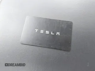 2018 Tesla Model 3 Long Range Battery with VIN 5YJ3E1EB4JF086012, listed as a IAAI auction lot 41683859 with 52,059 mi miles and . Bid and sale history available at DreamBid. Image 11.