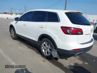 2015 Mazda CX-9 Sport with VIN JM3TB2BAXF0453244, listed as a IAAI auction lot 41905847 with 128,764 mi miles and . Bid and sale history available at carsss.com. Image 3.