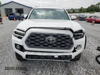 2023 Toyota Tacoma SR z VIN 3TMCZ5AN2PM583382, wystawiony jako Copart lot #58209775 z przebiegiem 17 442 mil mil oraz Szkoda całkowita • Salvage title. Historia ofert i sprzedaży dostępna na DreamBid. Obrazek 5.