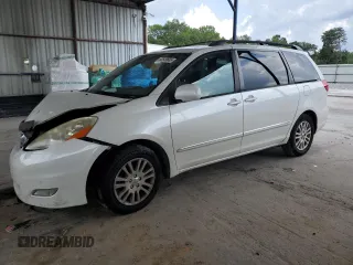 2010 Toyota Sienna XLE with VIN 5TDYK4CCXAS335064, listed as a Copart auction lot 62649665 with 246,327 mi miles and Salvage title. Bid and sale history available at DreamBid. Image 1.