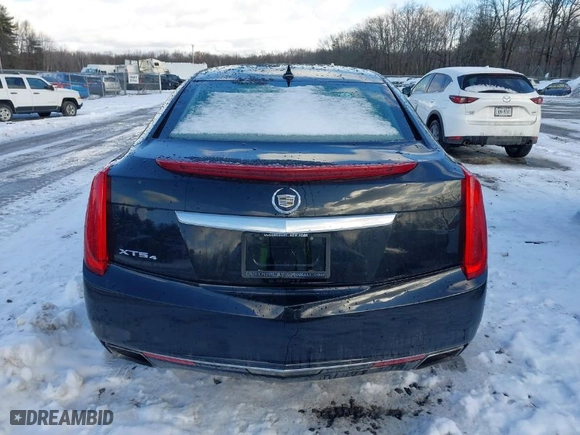 2013 Cadillac XTS Luxury with VIN 2G61R5S31D9106650, listed as a IAAI auction lot 41405091 with 143,545 mi miles. Bid and sale history available at carsss.com. Image 16.