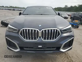 2020 BMW X6 xDrive40i z VIN 5UXCY6C03L9B94299, wystawiony jako Copart lot #53857965 z przebiegiem 54 133 mil mil oraz Szkody całkowita. Historia ofert i sprzedaży dostępna na DreamBid. Obrazek 5.