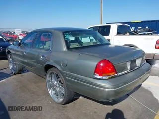 2002 Ford Crown Victoria Police Police Interceptor with VIN 2FAFP71W52X143053, listed as a IAAI auction lot 41594827 with 210,078 mi miles. Bid and sale history available at carsss.com. Image 3.