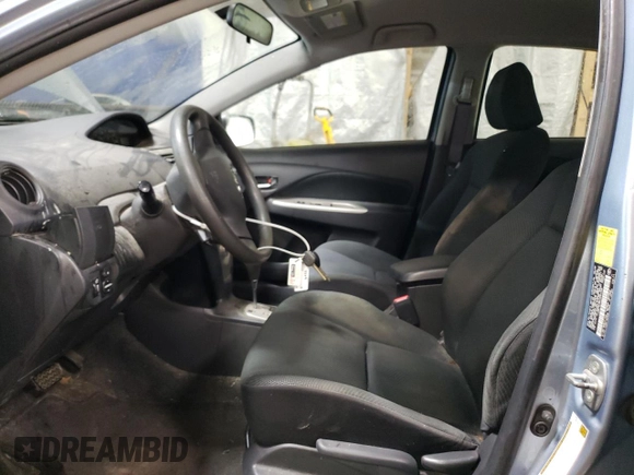 2010 Toyota Yaris with VIN JTDBT4K35A4064446, listed as a Copart auction lot 52099855 with 61,934 mi miles and Salvage Title. Bid and sale history available at carsss.com. Image 7.