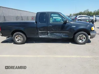 2003 Ford F-150 XL with VIN 1FTRX17213NB70553, listed as a IAAI auction lot 41946968 with 186,683 mi miles. Bid and sale history available at carsss.com. Image 6.