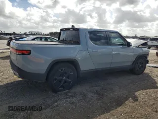 2023 Rivian R1T Adventure with VIN 7FCTGBAA2PN028983, listed as a Copart auction lot 45307015 with 220 mi miles and Salvage Title. Bid and sale history available at DreamBid. Image 3.