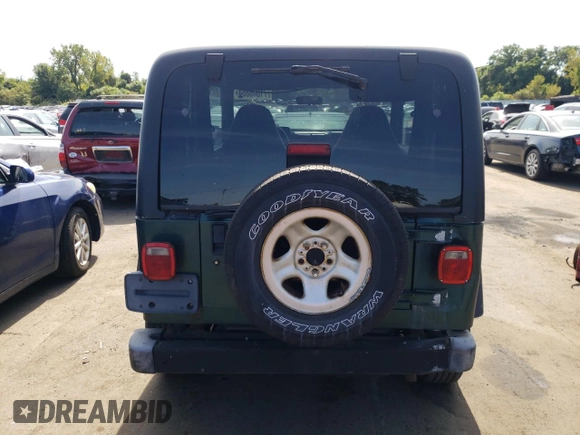 2000 Jeep Wrangler Sport with VIN 1J4FA49S4YP741154, listed as a Copart auction lot 71006864 with 200,684 mi miles and Clean Title. Bid and sale history available at carsss.com. Image 6.