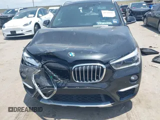 2017 BMW X1 xDrive28i with VIN WBXHT3Z30H4A65417, listed as a IAAI auction lot 42328797 with 103,788 mi miles and . Bid and sale history available at DreamBid. Image 12.