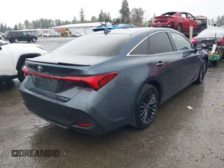 2021 Toyota Avalon Hybrid XSE z VIN 4T1EA1AB9MU007905, wystawiony jako IAAI lot #40501204 z przebiegiem 86 869 mil mil oraz . Historia ofert i sprzedaży dostępna na DreamBid. Obrazek 4.