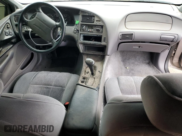 1994 Ford Thunderbird LX with VIN 1FALP6241RH110457, listed as a Copart auction lot 76384254 with 54,653 mi miles and Salvage Title. Bid and sale history available at DreamBid. Image 8.