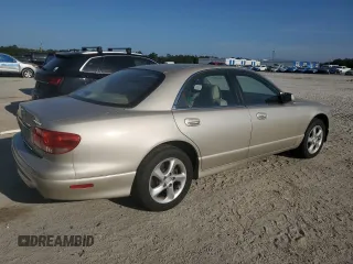 2001 Mazda Millenia z VIN JM1TA221911716600, wystawiony jako Copart lot #57639185 z przebiegiem 86 947 mil mil oraz Tytuł czysty. Historia ofert i sprzedaży dostępna na DreamBid. Obrazek 3.
