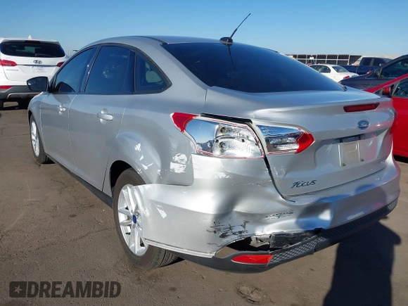 2018 Ford Focus SE z VIN 1FADP3F27JL204873, wystawiony jako IAAI lot #41657504 z przebiegiem 99 224 mil mil oraz . Historia ofert i sprzedaży dostępna na DreamBid. Obrazek 6.