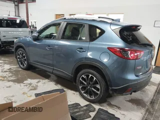 2016 Mazda CX-5 Grand Touring z VIN JM3KE4DY9G0714468, wystawiony jako IAAI lot #41860956 z przebiegiem 114 481 mil mil oraz . Historia ofert i sprzedaży dostępna na DreamBid. Obrazek 3.