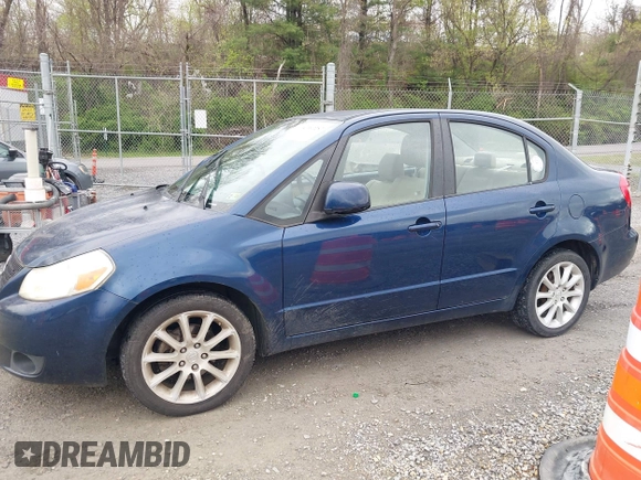 2011 Suzuki SX4 LE with VIN JS2YC5A23B6304713, listed as a IAAI auction lot 41997287 with 114,024 mi miles. Bid and sale history available at carsss.com. Image 14.
