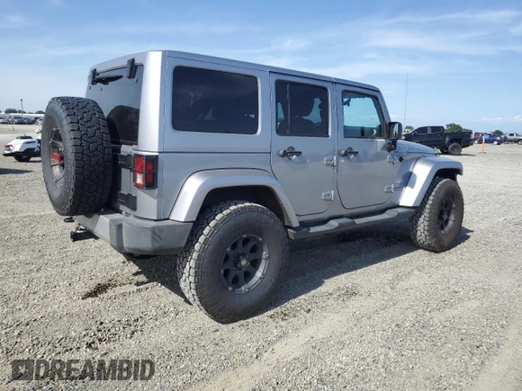 2014 Jeep Wrangler Unlimited Sahara with VIN 1C4HJWEG1EL126611, listed as a Copart auction lot 57169485 with 122,000 mi miles and Salvage title. Bid and sale history available at DreamBid. Image 3.