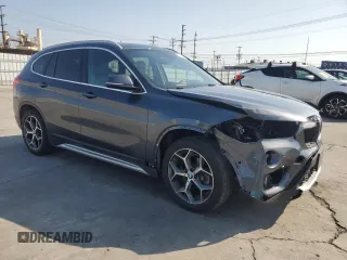 2018 BMW X1 sDrive28i with VIN WBXHU7C35J5L09783, listed as a Copart auction lot 55147935 with 37,114 mi miles and Salvage Title. Bid and sale history available at DreamBid. Image 4.