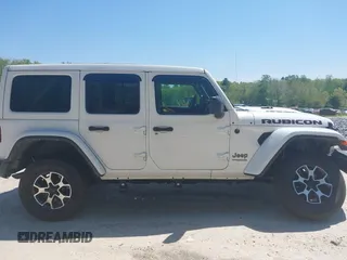 2021 Jeep Wrangler Unlimited Rubicon with VIN 1C4HJXFG5MW586842, listed as a IAAI auction lot 42186683 with 76,450 mi miles and . Bid and sale history available at DreamBid. Image 13.