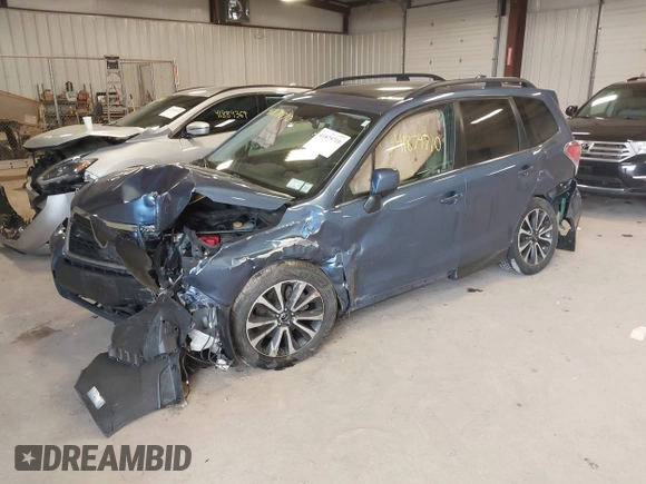 2018 Subaru Forester Premium with VIN JF2SJGECXJH606668, listed as a IAAI auction lot 41879710 with 64,910 mi miles. Bid and sale history available at carsss.com. Image 17.