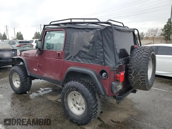 2001 Jeep Wrangler SE with VIN 1J4FA29P61P303287, listed as a Copart auction lot 48583385 with 162,447 mi miles and Salvage Title. Bid and sale history available at carsss.com. Image 2.