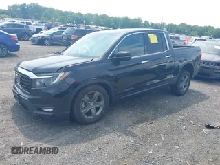 2023 Honda Ridgeline RTL-E with VIN 5FPYK3F71PB022739, listed as a IAAI auction lot 42447428 with 19,702 mi miles and . Bid and sale history available at DreamBid. Image 17.