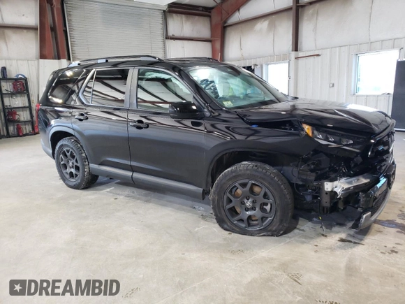 2023 Honda Pilot TrailSport with VIN 5FNYG1H63PB031249, listed as a Copart auction lot 85163934 with 12,058 mi miles and Salvage Title. Bid and sale history available at carsss.com. Image 4.