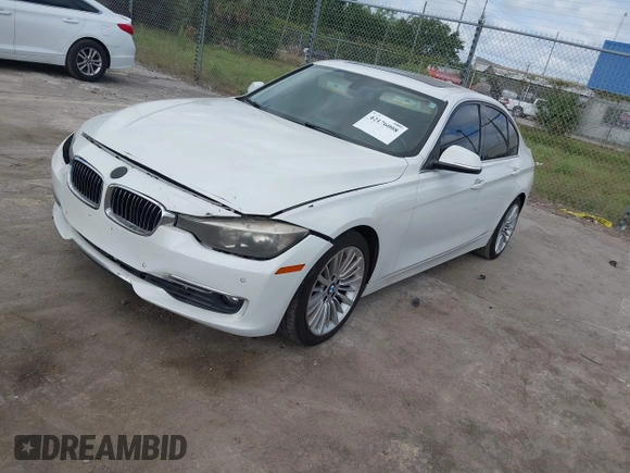 2012 BMW 3 Series 328i with VIN WBA3A5C57CF347953, listed as a IAAI auction lot 42176008 with 140,598 mi miles and . Bid and sale history available at carsss.com. Image 2.