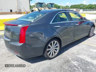 2014 Cadillac ATS Luxury RWD z VIN 1G6AB5RAXE0142079, wystawiony jako IAAI lot #42517963 z przebiegiem 140 118 mil mil oraz . Historia ofert i sprzedaży dostępna na DreamBid. Obrazek 4.