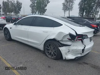 2020 Tesla Model 3 Long Range with VIN 5YJ3E1EB0LF803217, listed as a IAAI auction lot 41871940 with 130,391 mi miles. Bid and sale history available at carsss.com. Image 3.