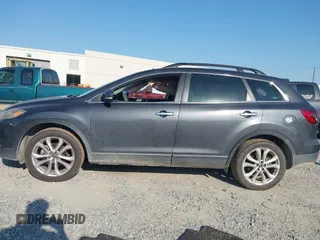 2013 Mazda CX-9 Grand Touring z VIN JM3TB2DA6D0424124, wystawiony jako IAAI lot #42032588 z przebiegiem 151 569 mil mil oraz . Historia ofert i sprzedaży dostępna na DreamBid. Obrazek 14.