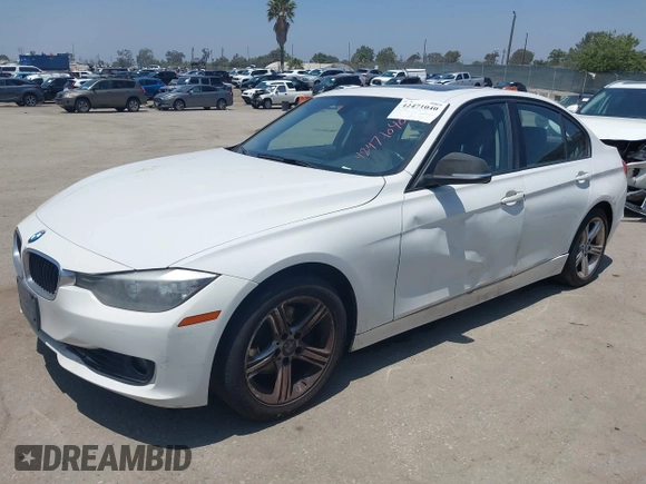 2014 BMW 3 Series 328i with VIN WBA3C1C59EK111396, listed as a IAAI auction lot 42471040 with 182,636 mi miles and . Bid and sale history available at DreamBid. Image 2.